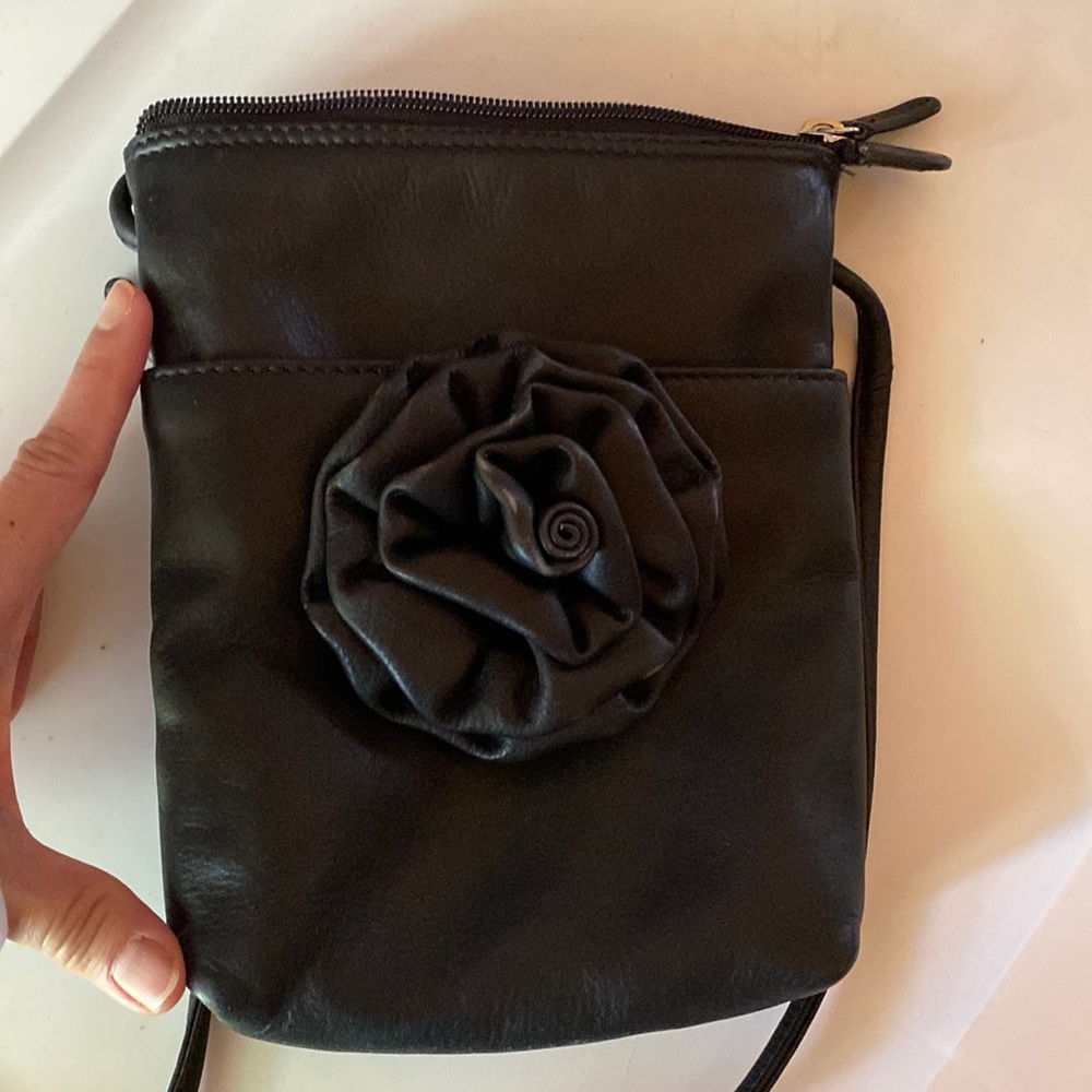 Leather crossbody. Slight discoloration and misshapen only due to washing